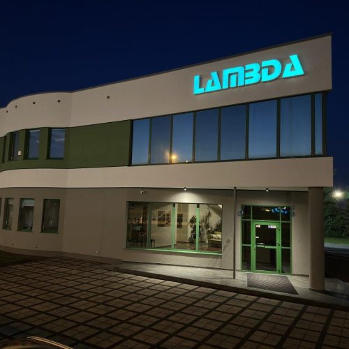 Grupa Lambda office building at night with blue illuminated logo using Cast Black Dual Colour film.