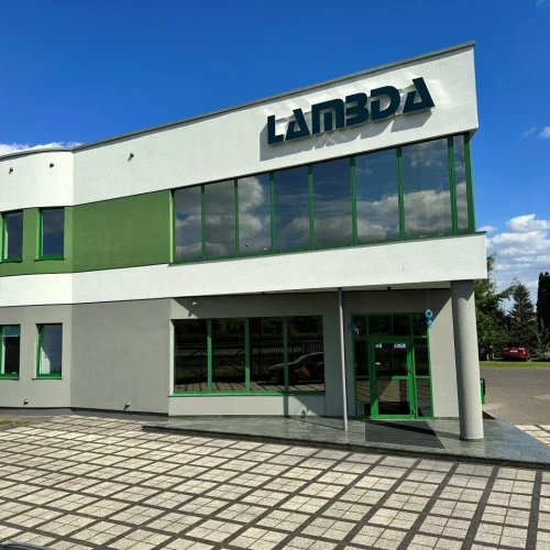 Exterior office building glass facade featuring signage made with Contra Vision dual colour window film.