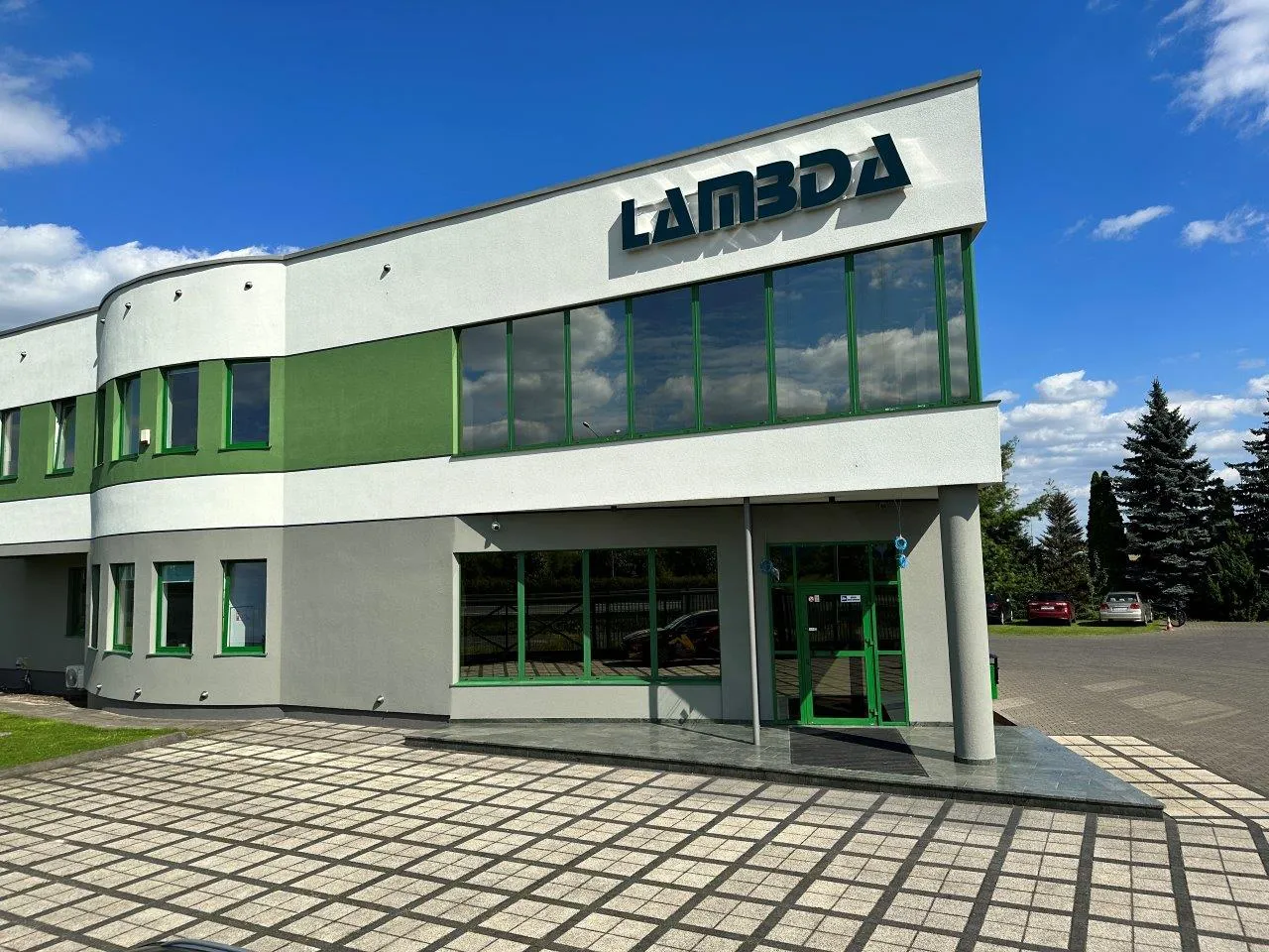 Exterior office building glass facade featuring signage made with Contra Vision dual colour window film.