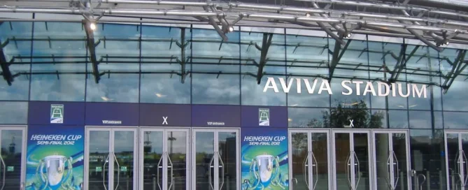 Perforated window graphics installation at Aviva Stadium, showcasing large-scale branding.