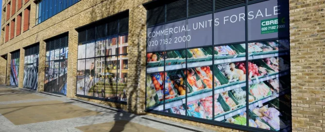 CBRE retail units with colourful fruit and lifestyle window graphics printed on perforated window film.