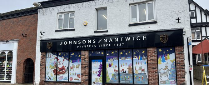Festive window graphics printed by Johnsons using Contra Vision film for a Christmas advertising campaign.