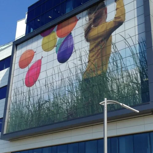 Exterior view of the Shriners Hospital in Montreal fully covered in custom architectural window film.