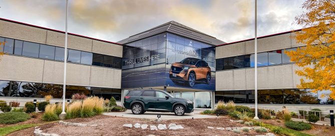 Exterior view of the Nissan Canada head office featuring a large building wrap made from perforated window film.