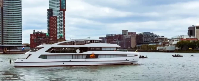 Modern white Royal Spido cruise ship on the Rotterdam river with perforated window film for passenger privacy.