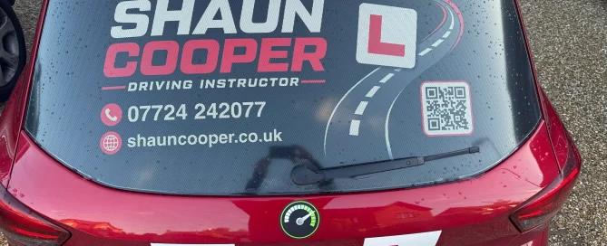 Rear window of Shaun Cooper Driving School car featuring graphics on Contra Vision Autograph